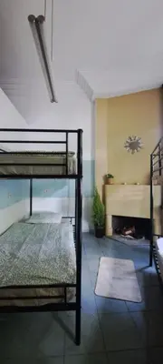 a room with two bunk beds and a fireplace at Smallfunnyworld Brussels in Brussels