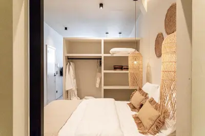 a bedroom with a bed with a mirror on the wall at Perfect-Stay in Antwerp