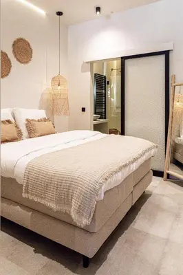 a bedroom with a large bed and a mirror at Perfect-Stay in Antwerp