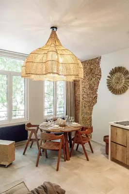 a dining room with a table and a large chandelier at Perfect-Stay in Antwerp