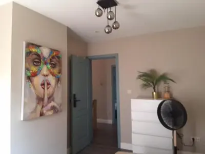 a painting of a woman on a wall in a room at Holiday in de kempen in Turnhout