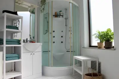 a bathroom with a shower and a sink at Cozy private suite in Ghent