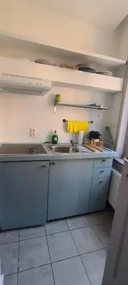 a kitchen with a sink and a counter top at Résidence Marianne 2 in Brussels