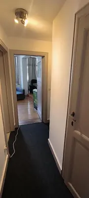 an open hallway with a living room and a room with at Résidence Marianne 2 in Brussels