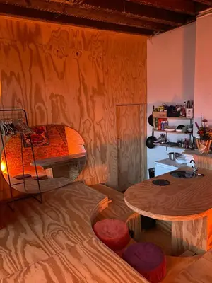 a room with a bed and a table and chairs at t'PK in Antwerp