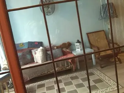 a room with a shelf with many items on it at Artistic appartment near downtown & railwaystation in Antwerp