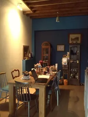 a room with a table with a laptop on it at Artistic appartment near downtown & railwaystation in Antwerp