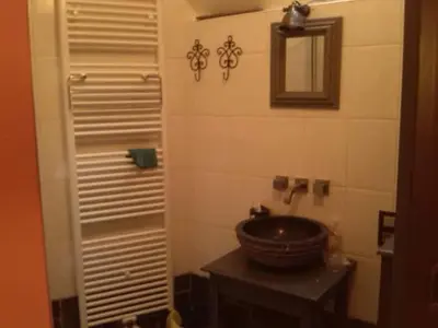 a bathroom with a sink and a mirror at Artistic appartment near downtown & railwaystation in Antwerp