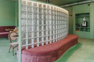 a wall with a bench in a room at The Mila Hotel in Brussels