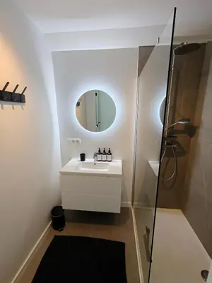 a bathroom with a sink and a mirror at Vakantiewoning DRP29 in Zelem