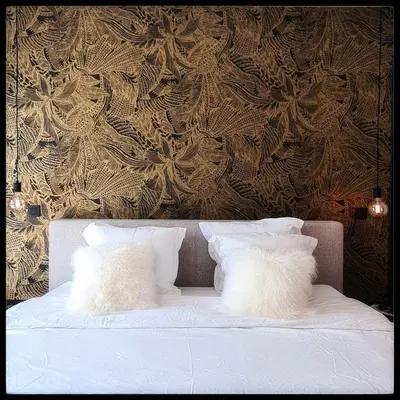two white pillows sitting on a bed with a wall at BeMe in Waterloo