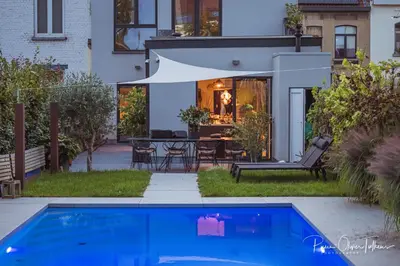 a house with a blue swimming pool in the yard at BeMe in Waterloo