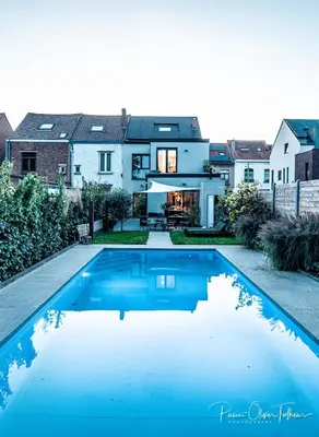 a house with a swimming pool in front of a house at BeMe in Waterloo