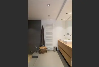 a bathroom with a sink and a vanity and a sink at Flagey Terrace Design residence in Brussels