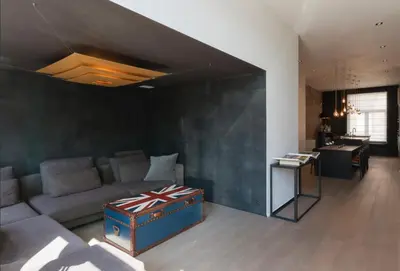 a living room with a couch and a table at Flagey Terrace Design residence in Brussels