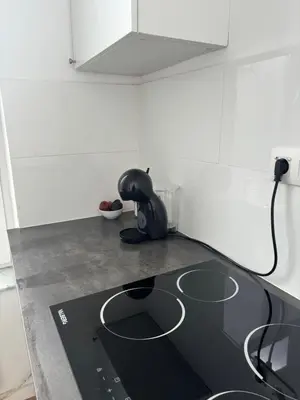 a kitchen with a counter top with a stove at Studio Issa in Brussels