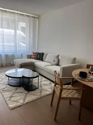 a living room with a couch and a table at Beautiful apartment Antwerp in Antwerp