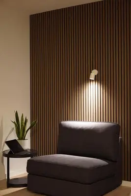 a room with a couch and a lamp and a table at Skyway airport apartments in Zaventem