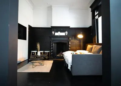 a bedroom with a bed and a fireplace at Prestige Stay - Uptown in Brussels