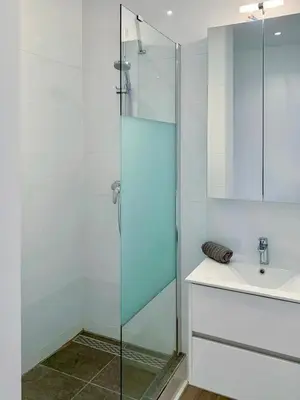 a bathroom with a glass shower and a sink at Prestige Stay - Uptown in Brussels