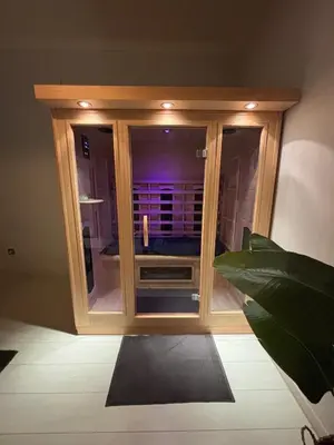 a room with a wooden cabinet with a window at Vakantiewoning Huis 14 in Mechelen