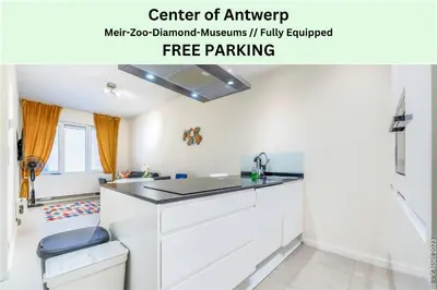 a kitchen with a white counter top in a room at Center of Antwerp - Fully Renovated - Private Indoor Parking in Antwerp
