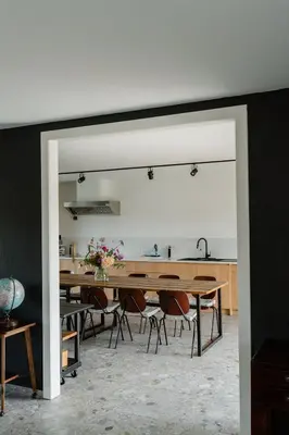a kitchen and dining room with a table and chairs at De Logé in Oud-Turnhout