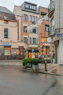 a city street with buildings and a traffic light at Le Joyau à Etterbeek in Brussels