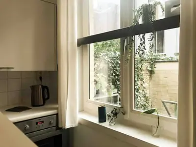 a kitchen window with a view of a building at Chère Anna City Center New Top location in Ghent