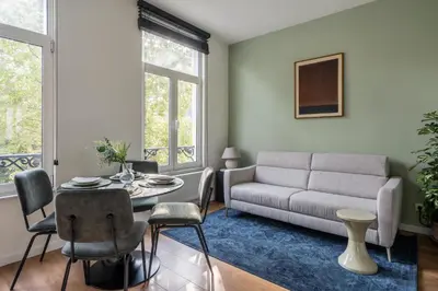 a living room with a couch and a table at Moneta in Antwerp