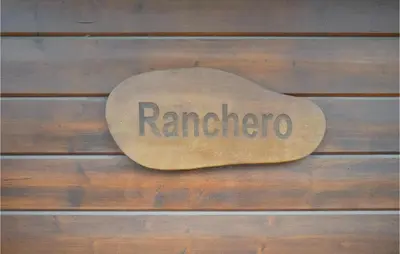 a sign that says raminato on a wooden table at Ranchero in Wachtebeke