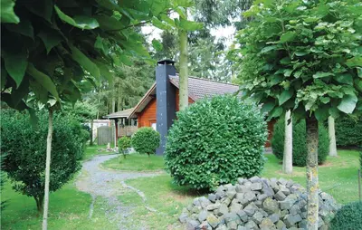 a house with a pile of rocks in front of it at Ranchero in Wachtebeke