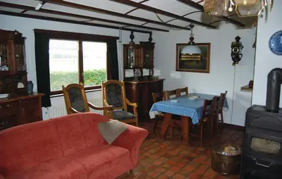 a living room with a couch and a table at Groene Vallei in Wachtebeke
