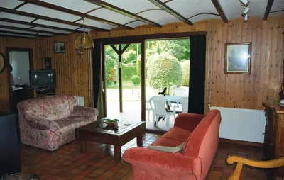 a living room with a couch and a chair at Groene Vallei in Wachtebeke