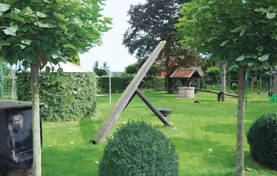 a wooden ladder in the grass in a park at Sjapoo in Wachtebeke