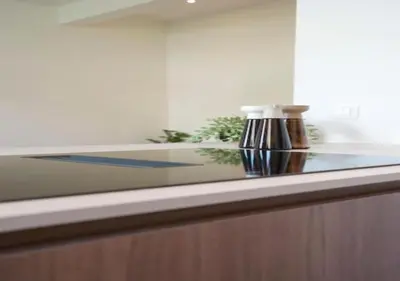 a glass counter top with a vase on it at Elegant Escape in hartje Zuid in Antwerp