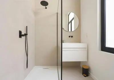a bathroom with a shower and a sink and a mirror at Elegant Escape in hartje Zuid in Antwerp