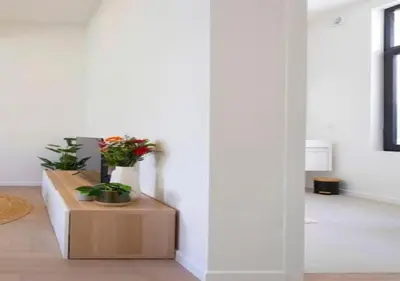 a living room with a table with plants on it at Elegant Escape in hartje Zuid in Antwerp