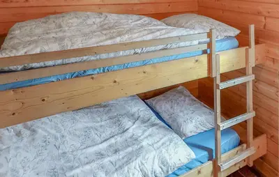 two bunk beds in a room with a bed at Flamenco in Wachtebeke