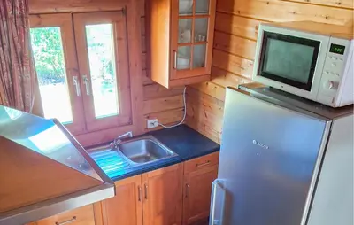 a kitchen with a refrigerator and a microwave at Flamenco in Wachtebeke