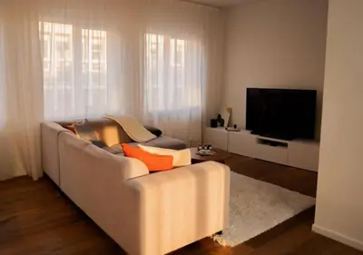 a living room with a couch and a flat screen tv at Magic in the Heart of Antwerp! in Antwerp