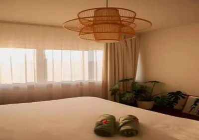 a pair of shoes sitting on top of a bed at Magic in the Heart of Antwerp! in Antwerp