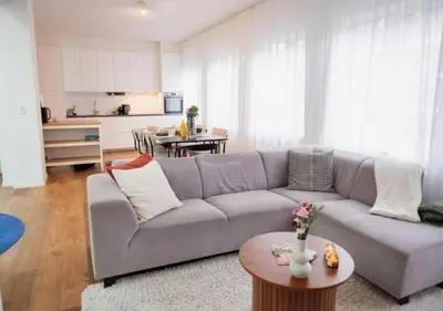 a living room with a couch and a table at Magic in the Heart of Antwerp! in Antwerp