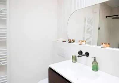 a bathroom with a sink and a mirror at Magic in the Heart of Antwerp! in Antwerp