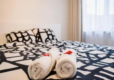 a hotel room with towels on a bed at Magic in the Heart of Antwerp! in Antwerp