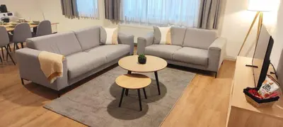 a living room with a couch and a table at Beautiful apartment in City Center in Brussels