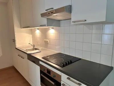 a kitchen with a sink and a stove top oven at Beautiful apartment in City Center in Brussels