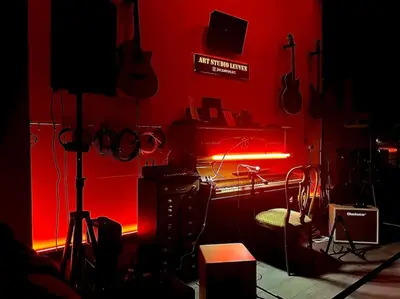 a room with a red wall with a red light at Art Studio Leuven in Leuven