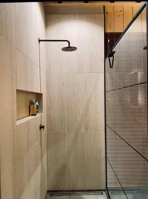 a shower with a glass door in a bathroom at AWolf in a healthy NEW home in Herentals