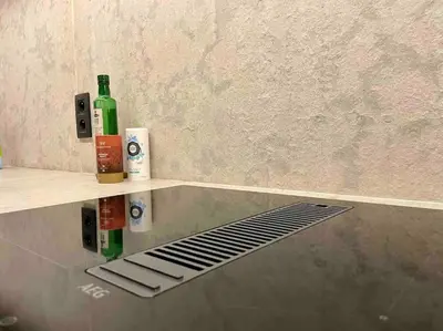 a bathroom with two bottles of alcohol on a shelf at AWolf in a healthy NEW home in Herentals